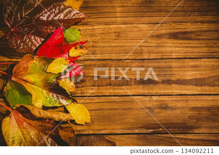 Wooden table with autumn leaves Wooden table with autumn leaves 134092211