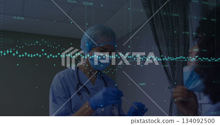Preparing nurse in scrubs, gloves and mask holding swab and stethoscope in clinic, digital overlay 134092500