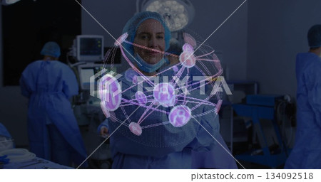 In operating room, medical professional observing image of digital network of cells In operating room, medical professional observing image of digital network of cells 134092518