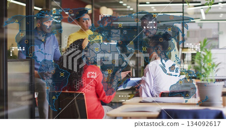 Collaborating five professionals discussing data plan in modern office with laptop and map overlay Collaborating five professionals discussing data plan in modern office with laptop and map overlay 134092617
