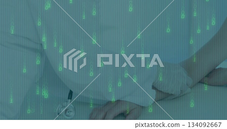 Scrub-clad nurse holding gowned patient wrist on exam table, with stethoscope and binary overlay 134092667