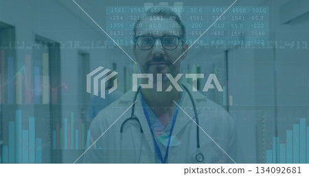 Standing doctor wearing medical coat in hospital corridor, with stethoscope and data overlays Standing doctor wearing medical coat in hospital corridor, with stethoscope and data overlays 134092681
