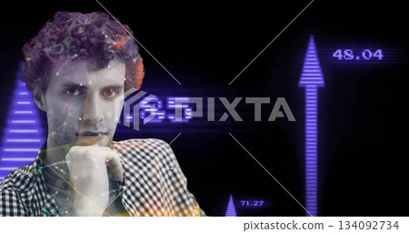 Analyzing male wearing checkered shirt resting chin on hand in studio financial charts, copy space 134092734
