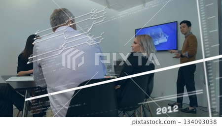 Four professionals reviewing 3D model in conference room, with laptop and wall monitor Four professionals reviewing 3D model in conference room, with laptop and wall monitor 134093038