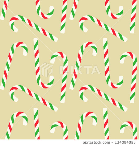 Beige pattern of Christmas candy canes with green and white stripes on cream background. Suitable for holiday packaging, wallpaper, or backdrops. Beige pattern of Christmas candy canes with green and white stripes on cream background. Suitable for holiday packaging, wallpaper, or backdrops. 134094083