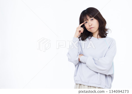A woman who is seriously worried A woman who is seriously worried 134094273