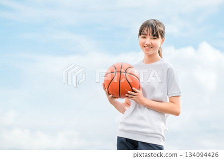 Girls, children, elementary school students, junior high school students, high school students wearing gym clothes and holding basketballs Girls, children, elementary school students, junior high school students, high school students wearing gym clothes and holding basketballs 134094426