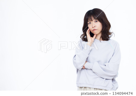 A woman who is seriously worried A woman who is seriously worried 134094474
