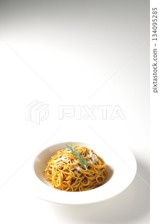 Spaghetti meat sauce with grated cheese and rosemary photographed on a white background 134095285