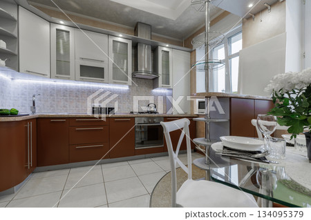 Modern Kitchen Interior with Cabinets, Countertop and Gas Stove Modern Kitchen Interior with Cabinets, Countertop and Gas Stove 134095379