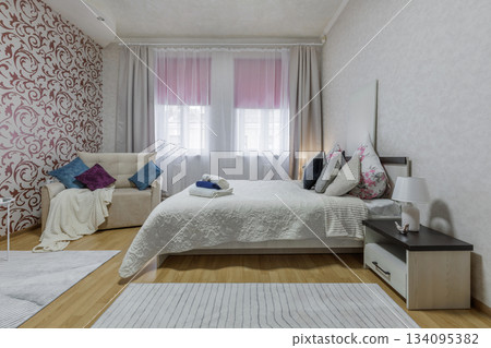 Cozy Modern Bedroom Interior with Soft Textiles 134095382