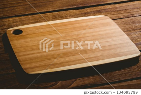 Wooden chopping board on floor Wooden chopping board on floor 134095789