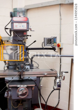 Flat design is depicting vertical milling machine with digital readout and yellow safety guard Flat design is depicting vertical milling machine with digital readout and yellow safety guard 134095828