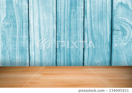 Displaying wooden tabletop before vertical light turquoise painted plank wall, flat design Displaying wooden tabletop before vertical light turquoise painted plank wall, flat design 134095831