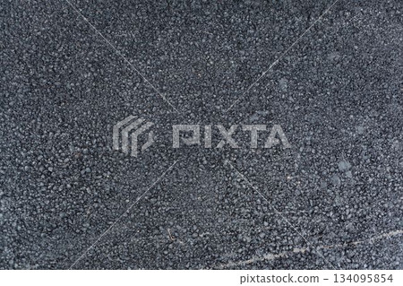 Gravel packed asphalt mixture is being shown in flat design illustration, highlighting loose stones Gravel packed asphalt mixture is being shown in flat design illustration, highlighting loose stones 134095854