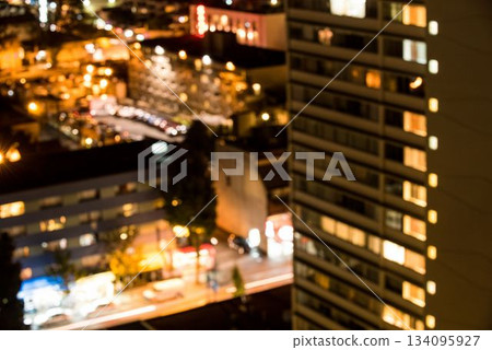 Illuminated buildings in city at night 134095927