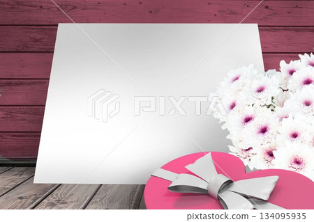 Box and flowers on wooden background Box and flowers on wooden background 134095935