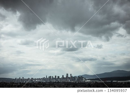 Cityscape against cloudy sky 134095937