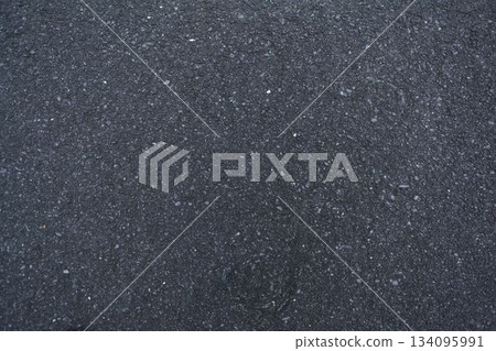 Realistic vector illustration showing rough asphalt surface with small stones and fine cracks 134095991