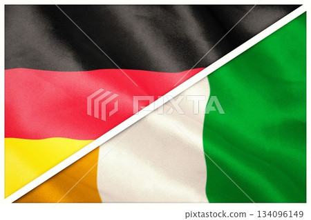 Close-up of German and Ivory Coast flags Close-up of German and Ivory Coast flags 134096149