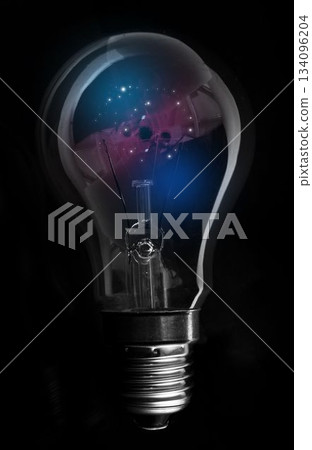 3D render clear bulb is glowing on black background, showing drifting blue and magenta particles 3D render clear bulb is glowing on black background, showing drifting blue and magenta particles 134096204