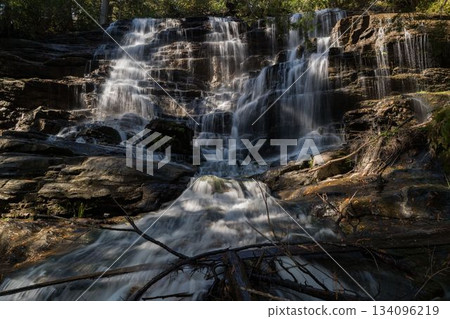 Beautiful waterfall on sunny day Beautiful waterfall on sunny day 134096219