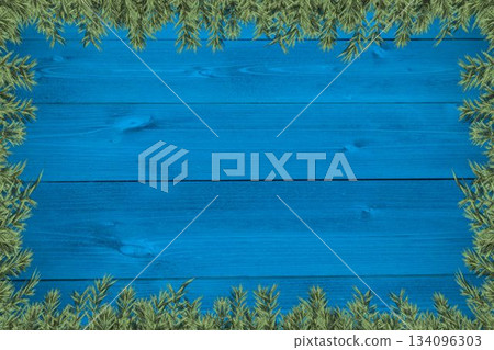 Plants forming frame against wooden table 134096303