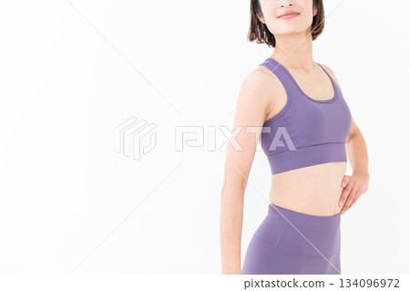 Slim middle-aged woman in yoga wear 134096972