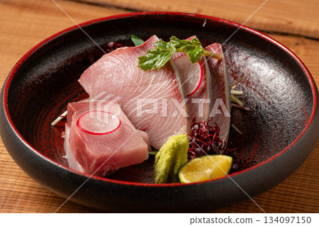 Sashimi topped with yellowtail sashimi 134097150