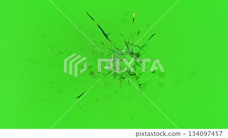 Freeze Motion Shot of Glass Shattered by a Bullet from a Pistol on Green Screen Background 134097457