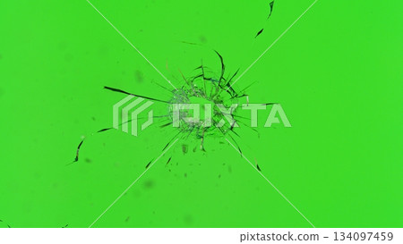 Freeze Motion Shot of Glass Shattered by a Bullet from a Pistol on Green Screen Background 134097459