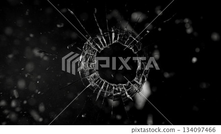 Freeze Motion Shot of Glass Shattered by a Bullet from a Pistol on Black Background 134097466