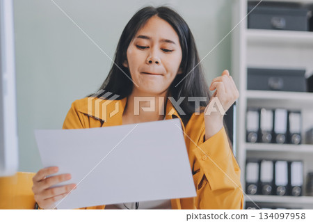 Headache, business woman at night and computer stress while working for a deadline with pc glitch. Sad corporate manager with anxiety about target working at desk screen late to complete task online 134097958