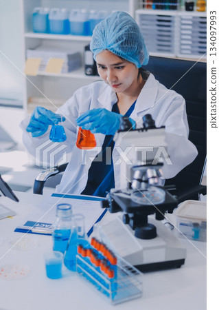 Portrait, science and happy woman on laptop in lab to research chemistry, test or innovation. Microscope, scientist and face of medical doctor in goggles for microbiology, healthcare or pharma study Portrait, science and happy woman on laptop in lab to research chemistry, test or innovation. Microscope, scientist and face of medical doctor in goggles for microbiology, healthcare or pharma study 134097993