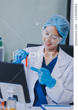 Portrait, science and happy woman on laptop in lab to research chemistry, test or innovation. Microscope, scientist and face of medical doctor in goggles for microbiology, healthcare or pharma study Portrait, science and happy woman on laptop in lab to research chemistry, test or innovation. Microscope, scientist and face of medical doctor in goggles for microbiology, healthcare or pharma study 134098003