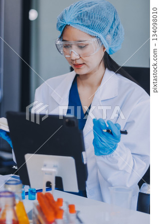 Portrait, science and happy woman on laptop in lab to research chemistry, test or innovation. Microscope, scientist and face of medical doctor in goggles for microbiology, healthcare or pharma study Portrait, science and happy woman on laptop in lab to research chemistry, test or innovation. Microscope, scientist and face of medical doctor in goggles for microbiology, healthcare or pharma study 134098010