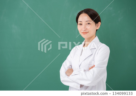 A woman in her white arm wearing her arms 134099133