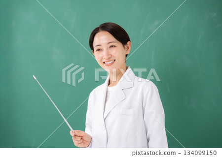 A woman pointing to the blackboard 134099150