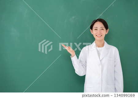 Woman in white coat holding hands 134099169