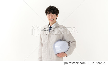 Portrait of a young man in work clothes 134099234