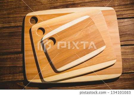 Chopping boards on wooden floor Chopping boards on wooden floor 134101083