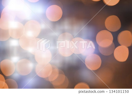 Soft-focus illustration showing bokeh pattern forming glowing light orbs over dark blurred backdrop Soft-focus illustration showing bokeh pattern forming glowing light orbs over dark blurred backdrop 134101150