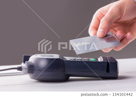 Man using smartphone to express pay 134101442