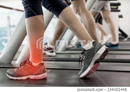 Jogger experiencing ankle pain Jogger experiencing ankle pain 134101446
