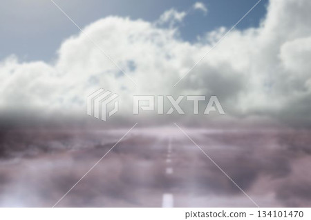 Road leading to clouds in foggy weather 134101470