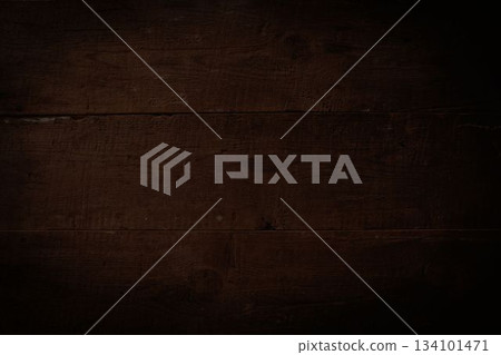 Dark brown wooden plank surface is showing weathered grain and knots in flat design Dark brown wooden plank surface is showing weathered grain and knots in flat design 134101471