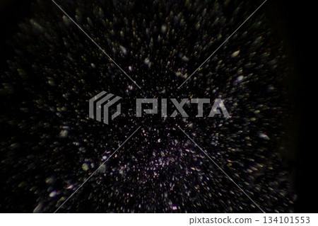 Glowing particles are floating across dark void in flat vector design, creating depth effect 134101553