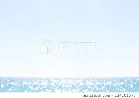 Ocean surface is reflecting sunlight on gentle waves in flat design, pale blue sky Ocean surface is reflecting sunlight on gentle waves in flat design, pale blue sky 134101575