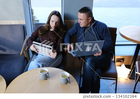 Caring Caucasian father man talking teach my daughter at work family care loving daddy parent touching little schoolgirl male dad supporting child bonding daughter guy discussing school trouble 134102164