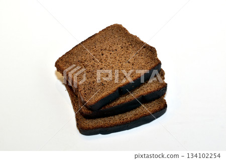 Slices of bread baked from rye flour. 134102254